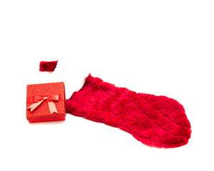 Studio shot red gift box and belt fur trimmed red sock isolated on white
