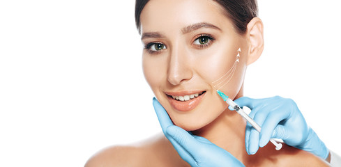 beautiful woman received procedure lifting skin. Injections with lifting arrows isolated on white