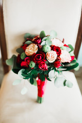 Obraz premium Beautiful wedding bouquet with different flowers, roses