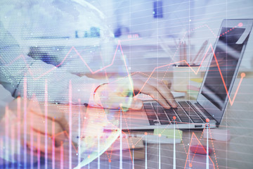 Multi exposure of stock market chart with man working on computer on background. Concept of financial analysis.