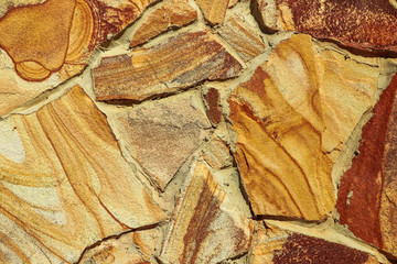 Texture of beautiful sandstone masonry of modern time. close up