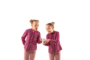 Young handsome girl arguing with herself on white studio background. Concept of human emotions,...