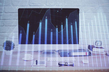 Forex graph hologram on table with computer background. Double exposure. Concept of financial markets.