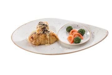 Golden fried stuffed chicken with mushroom sauce and fresh tomatoes isolated on white background