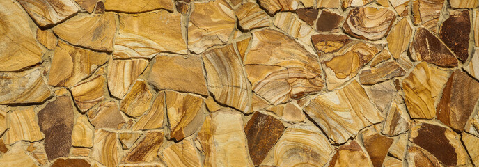 Texture of beautiful sandstone masonry of modern time. average plan. panoramic photo