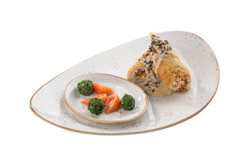 Golden fried stuffed chicken with mushroom sauce and fresh tomatoes isolated on white background
