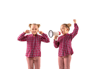 Young handsome girl arguing with herself on white studio background. Concept of human emotions,...