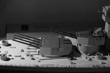 A close up of two front main gun turrets on a World War II battleship mode