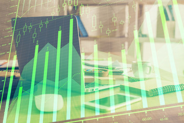 Financial chart drawing and table with computer on background. Double exposure. Concept of international markets.