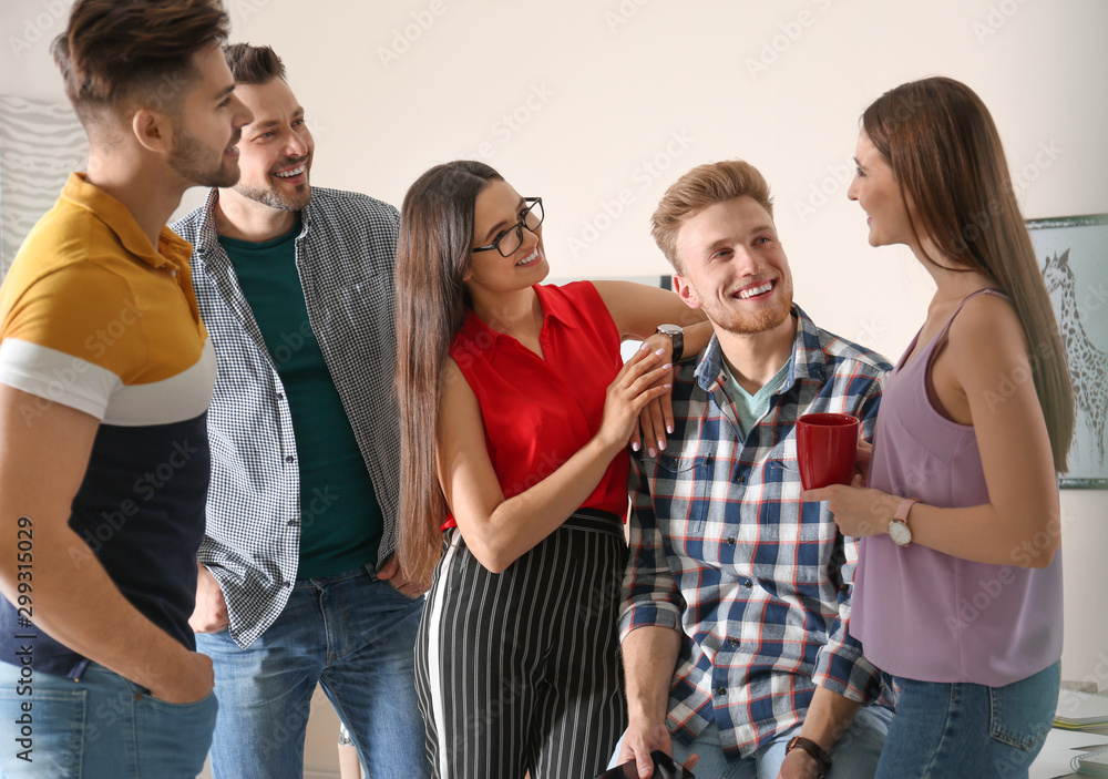 Wall mural Group of happy people talking in office