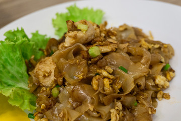 Close up stir fried noodles with chicken