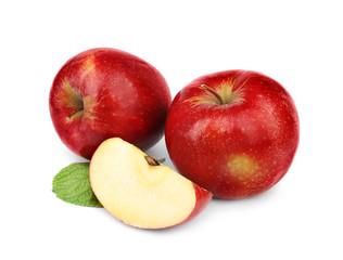 Fototapeta na wymiar Ripe juicy red apples with leaf on white background