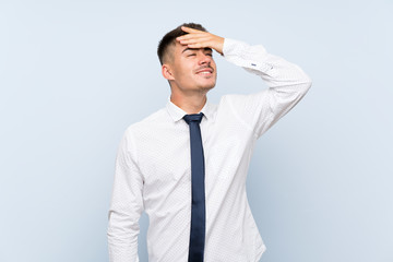Handsome businessman over isolated blue background laughing