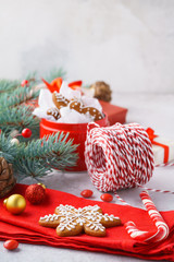 Christmas background with cookies, gift boxes, red decoration.