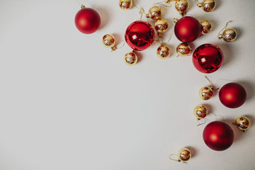 Christmas ornaments on the white background isolated. Red and golden christmas balls.