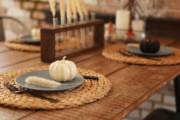 Wooden table decorated for Halloween in kitchen