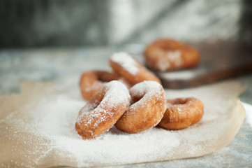 doughnuts in powdered sugar