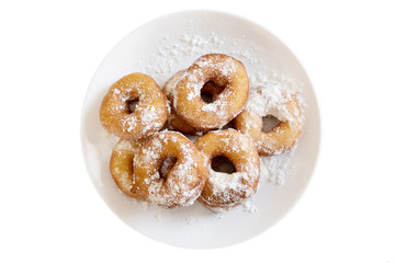 donuts on a plate in powdered sugar