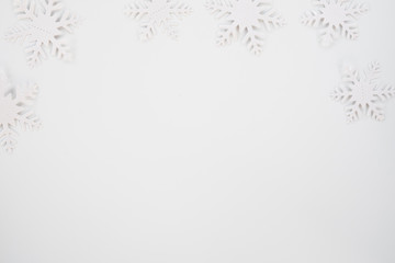 Christmas composition. Christmas frame made of snowflakes on white background. Winter concept. Flat lay, top view, copy space .