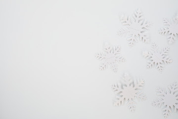 Christmas composition. Christmas frame made of snowflakes on white background. Winter concept. Flat lay, top view, copy space .