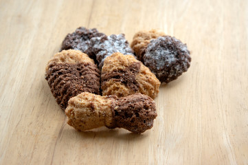 Cinnamon sandbakelse christmas cookies, two color, cocoa dark brown and vanilla light golden brown, delicious cookies