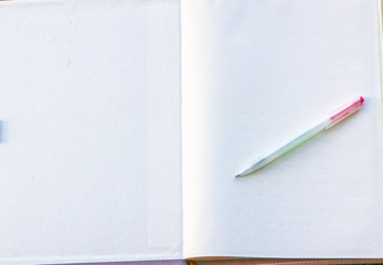 A pen placed on an open book