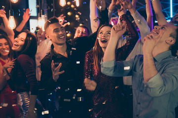 Photo of cheerful excited crazy beautiful young millennials dressed in formalwear celebrating...