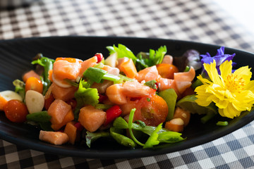 Salmon Salad with cherry tomatoes,  spinach, fresh celery and chili. Home made food. Concept for a...