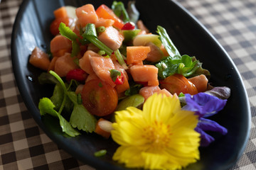 Salmon Salad with cherry tomatoes,  spinach, fresh celery and chili. Home made food. Concept for a tasty and healthy meal. Top view. Close up.