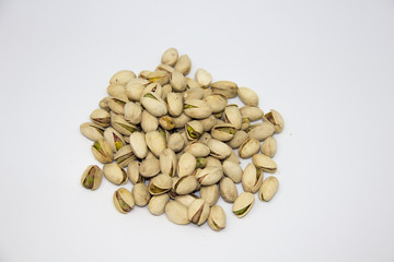 slide of pistachios on a white background. isolate