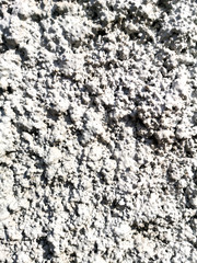 Concrete chips on the wall as abstract background