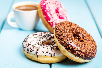 Sweet donuts on black stone table