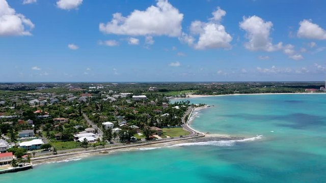 Aerial: Tropical Nassau With Road Along the Perimeter of Island and Beautiful Aquamarine Water 