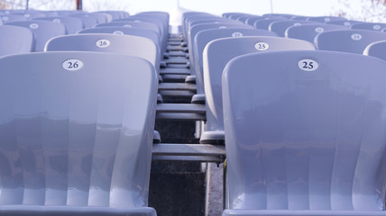 Gray stands in an empty stadium on a sunny day. Style and precision.