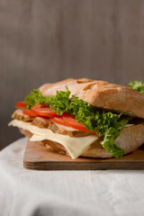 sandwich with ham cheese and vegetables
