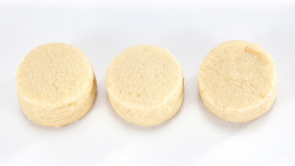 A cookie is a baked food that is typically small, flat and sweet. It usually contains flour, sugar and some type of oil or fat. It may include other ingredients such as raisins, oats, chocolate.