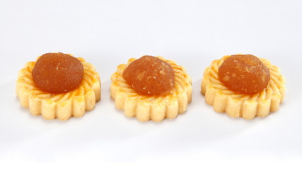 Pineapple tarts or nanas tart are small, bite-size pastries filled or topped with pineapple jam