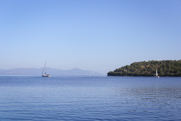 Obraz na płótnie Canvas Yacht Iarins and Sea Bays of the Greek Islands