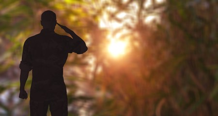 Young military soldier man silhouette on background