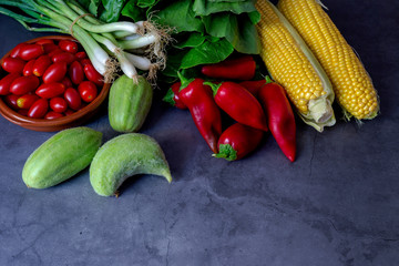 Different fresh vegetables on a wooden table