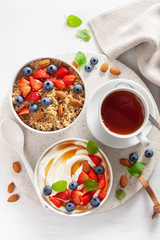 yogurt with strawberry blueberry honey almond and quinoa for breakfast