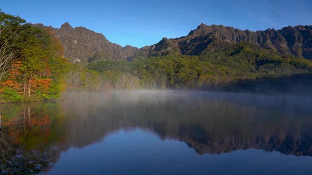 Kagami pond sunrise in autumn in Togakushi Japan