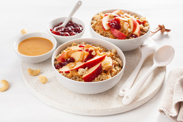 apple peanut butter quinoa bowl with jam and cashew for healthy breakfast