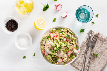 chicken breast with couscous, cucumber, avocado, spring onion, radish. healthy lunch