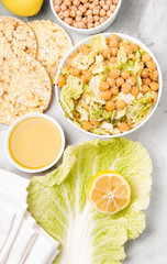 Vegetarian cuisine. Salad with chickpeas and cabbage, pasta, olive oil, crisp bread. 