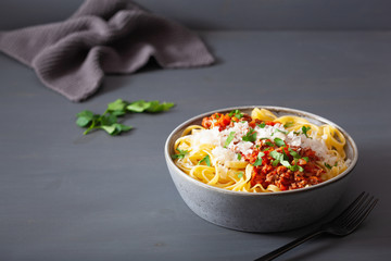tagliatelle bolognese with herbs and parmesan, italian pasta