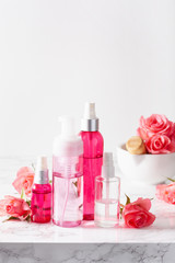 Obraz na płótnie Canvas bottles skincare lotion serum medical rose flowers. organic natural cosmetic