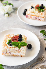 Pavlova on a biscuit with a gentle curd cream and fruit.