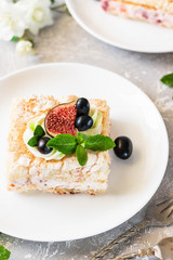 Pavlova on a biscuit with a gentle curd cream and fruit.