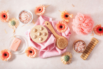 bath and body care products and daisy flowers. natural cosmetics for home spa treatment